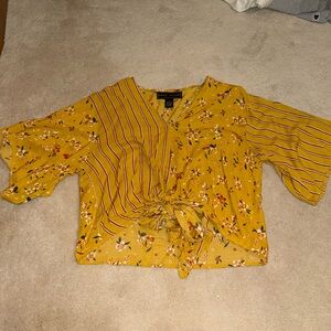 Polly Esther small floral/stripped yellow blouse with bow tie in front